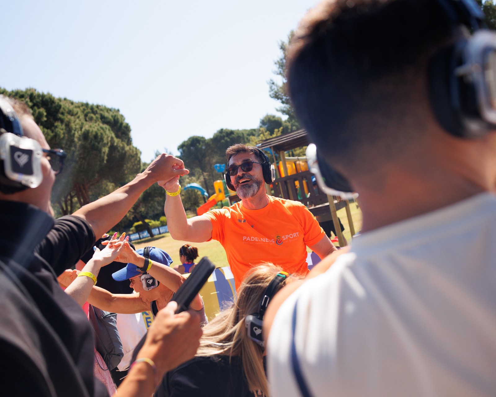 Emotion Fitness — A trainer working the crowd, microphone in hand